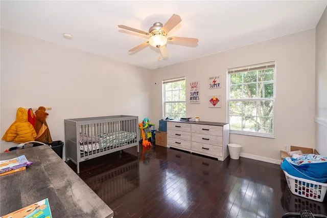 a bedroom with furniture and a window