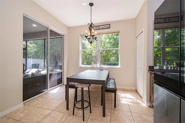 a dining room with furniture and window