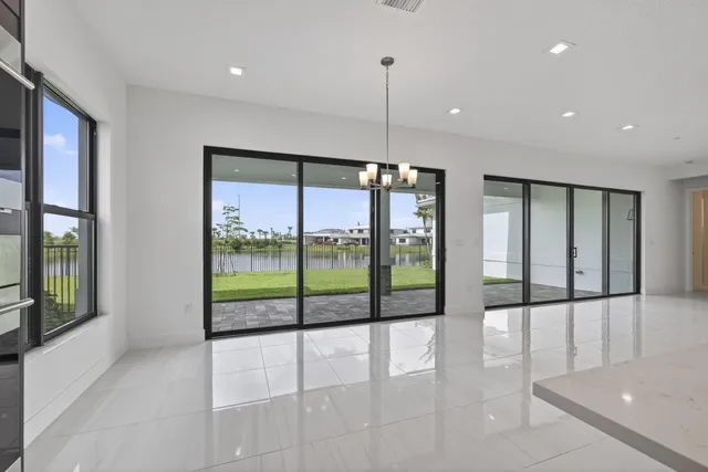a kitchen with a sink and large window