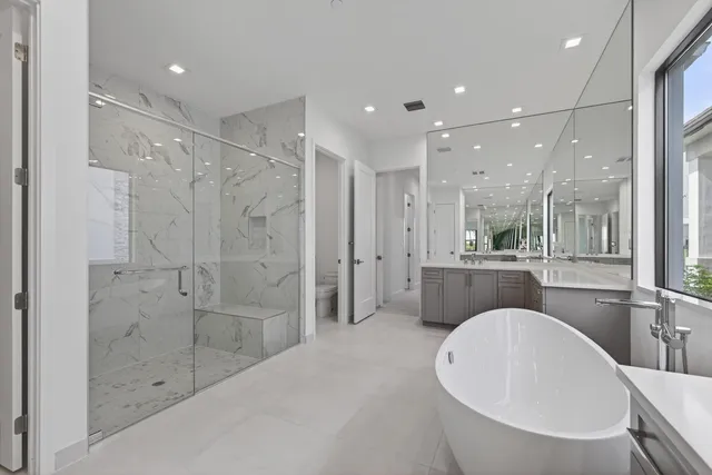 an empty room with wooden floor and entryway