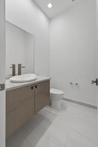 a bathroom with a shower and a glass door
