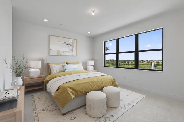 a view of staircase with railing and white walls