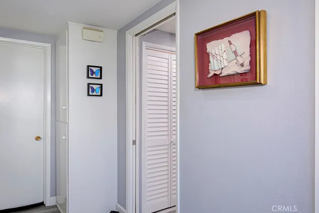a picture of a room with a painting on the wall