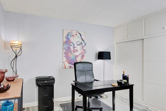 a view of a workspace with furniture