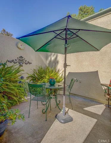 a view of a backyard with sitting area