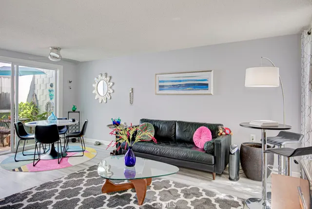 a living room with furniture toys and a window