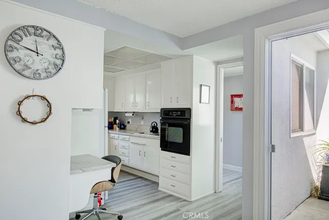 a view of a livingroom with furniture and wooden floor