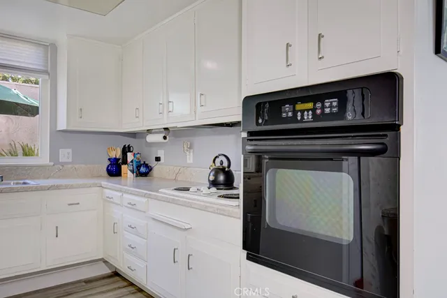 a kitchen with cabinets and appliances