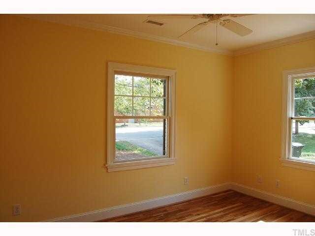 2113 Noble Road Raleigh, NC 27608 - Photo 6 of 11 a view of an empty room with a window