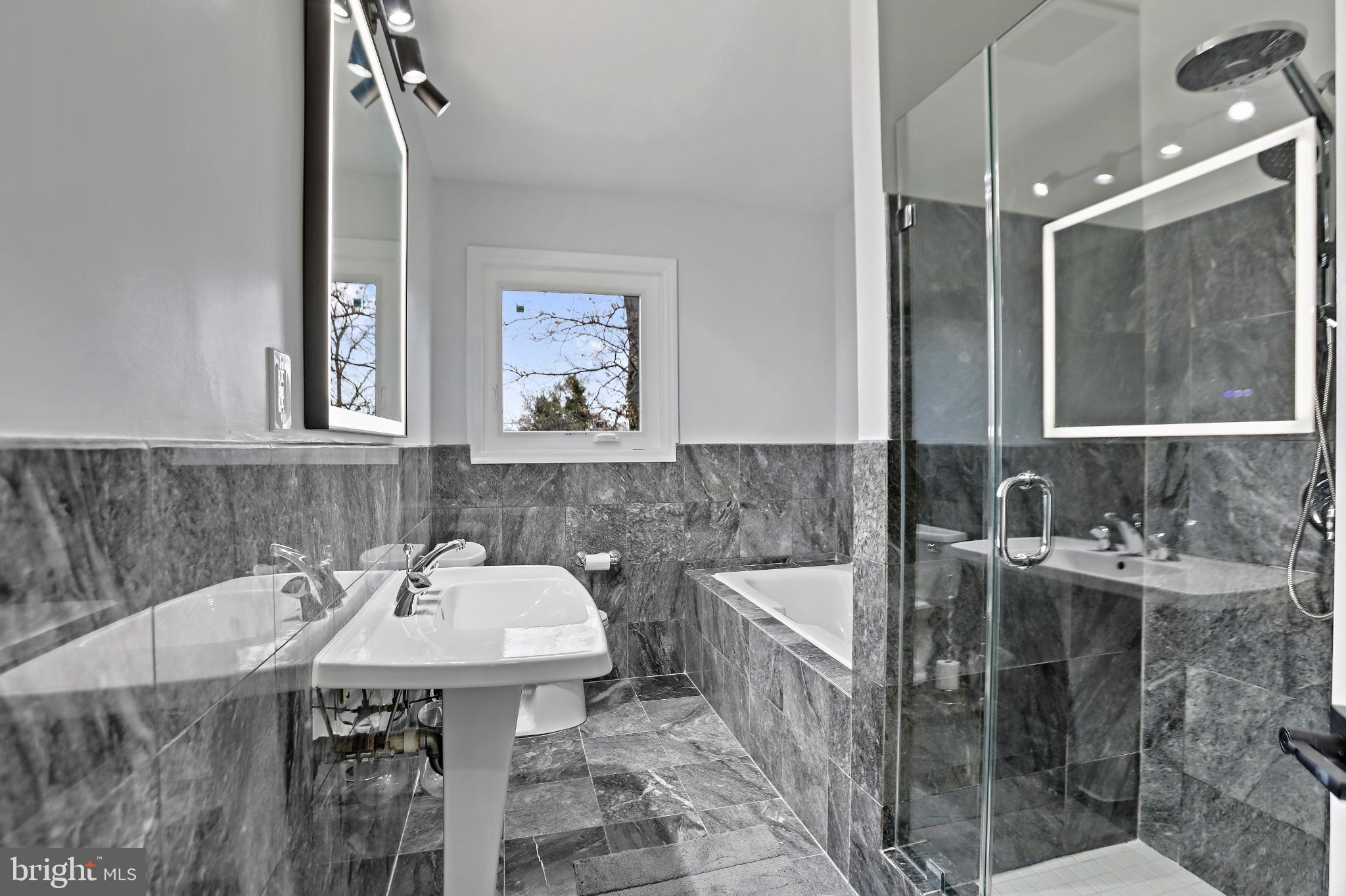 3906 Ridge Road Annandale, VA 22003 - Photo 13 of 34 a bathroom with a sink and a mirror