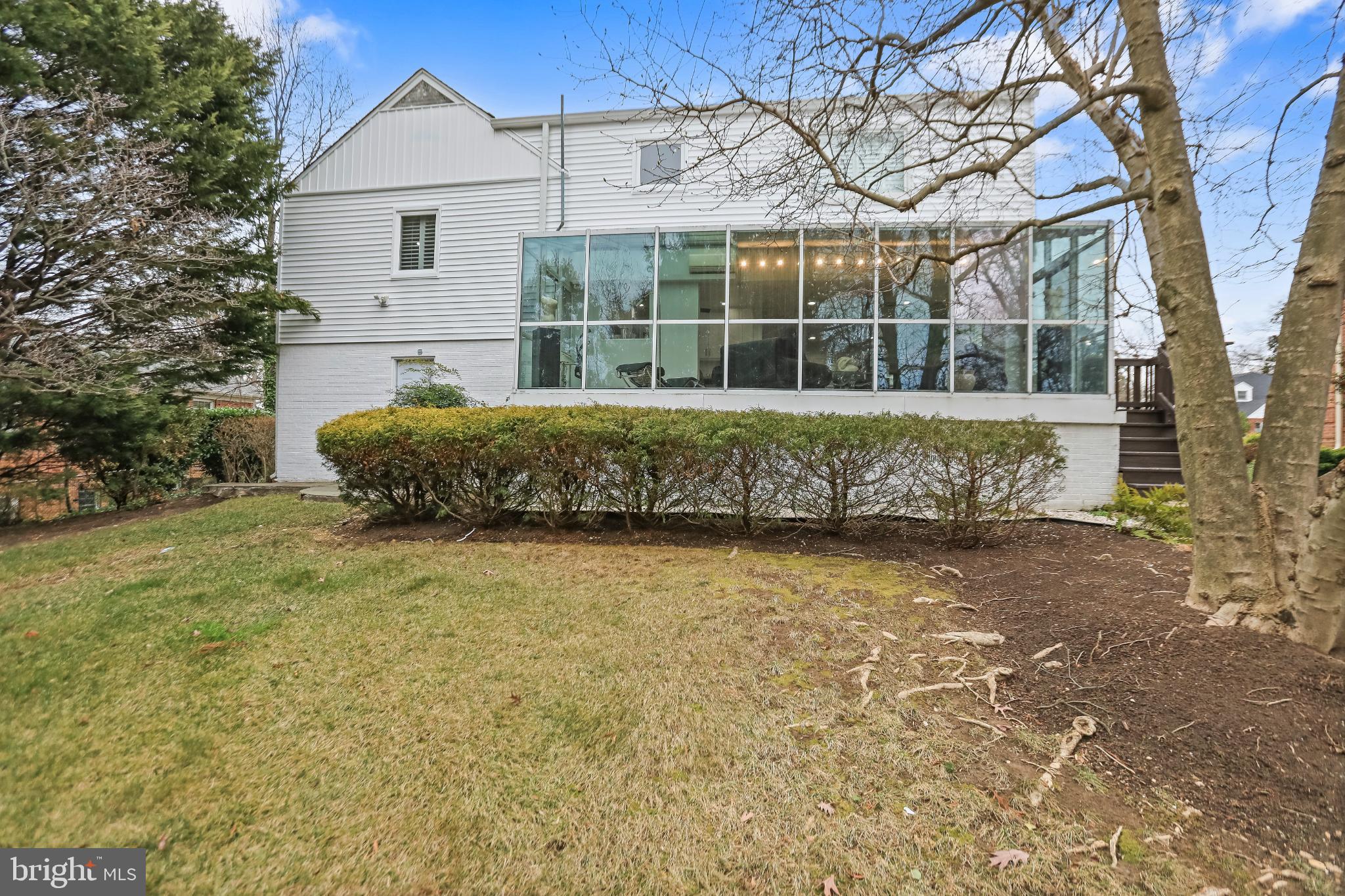 3906 Ridge Road Annandale, VA 22003 - Photo 19 of 34 a front view of a house with a garden