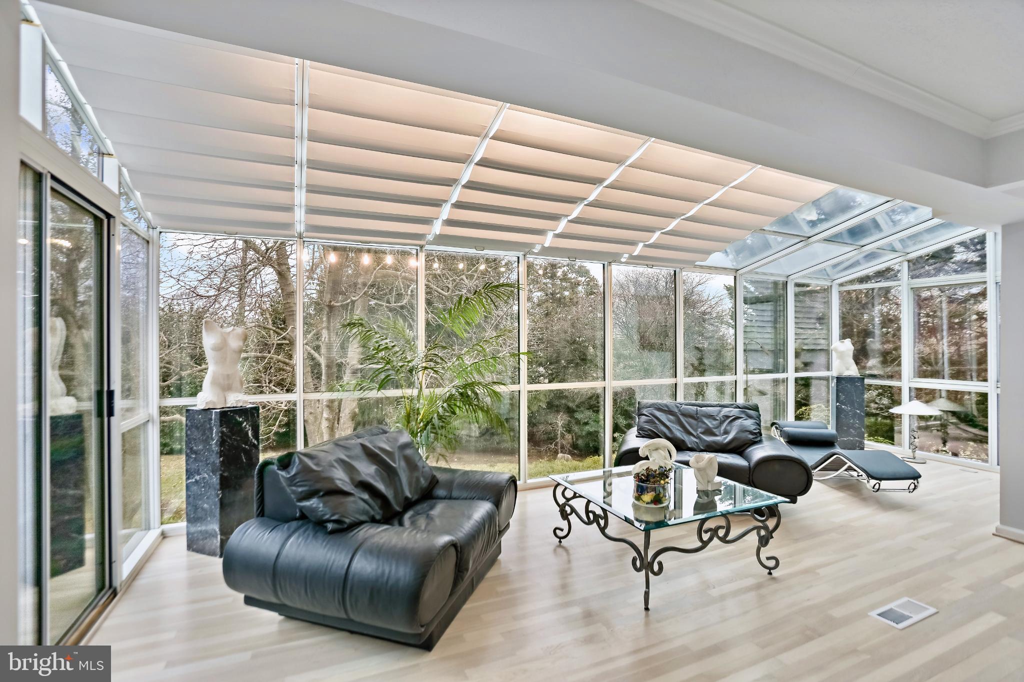 3906 Ridge Road Annandale, VA 22003 - Photo 5 of 34 a living room with furniture and floor to ceiling windows