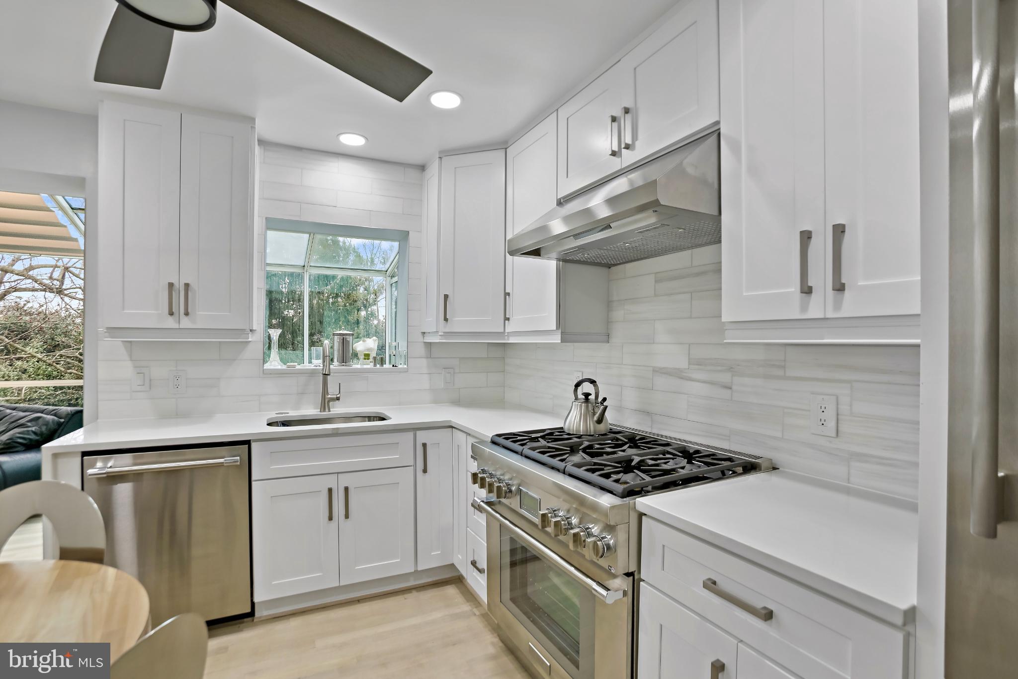 3906 Ridge Road Annandale, VA 22003 - Photo 10 of 34 a kitchen with stainless steel appliances a sink stove and cabinets