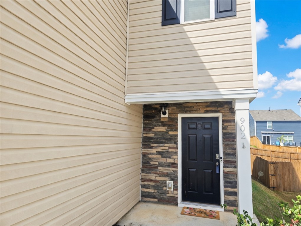 902 Ashwood Lane Easley, SC 29640 - Photo 3 of 39 Stone veneer accents and cream siding define this welcoming front entrance.