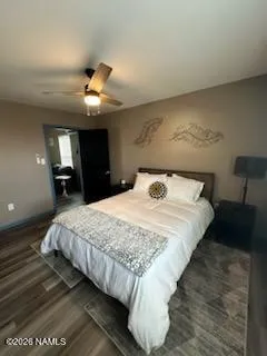 a bedroom with bed and a chandelier