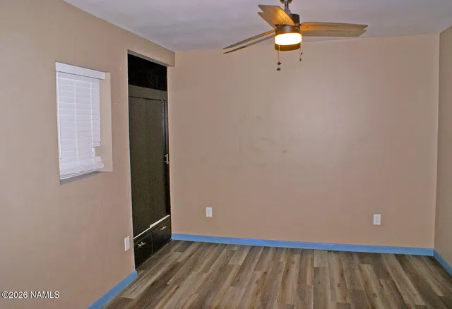 a view of an empty room with a window