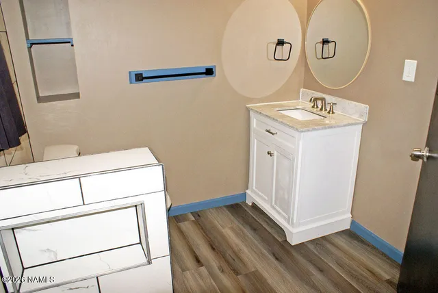 a bathroom with a sink and a mirror