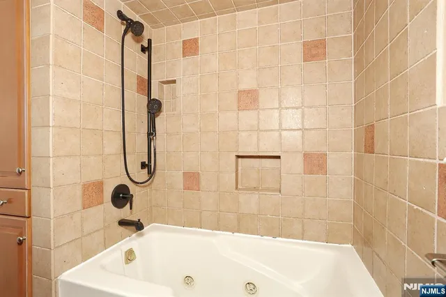 a bathroom with a bath tub