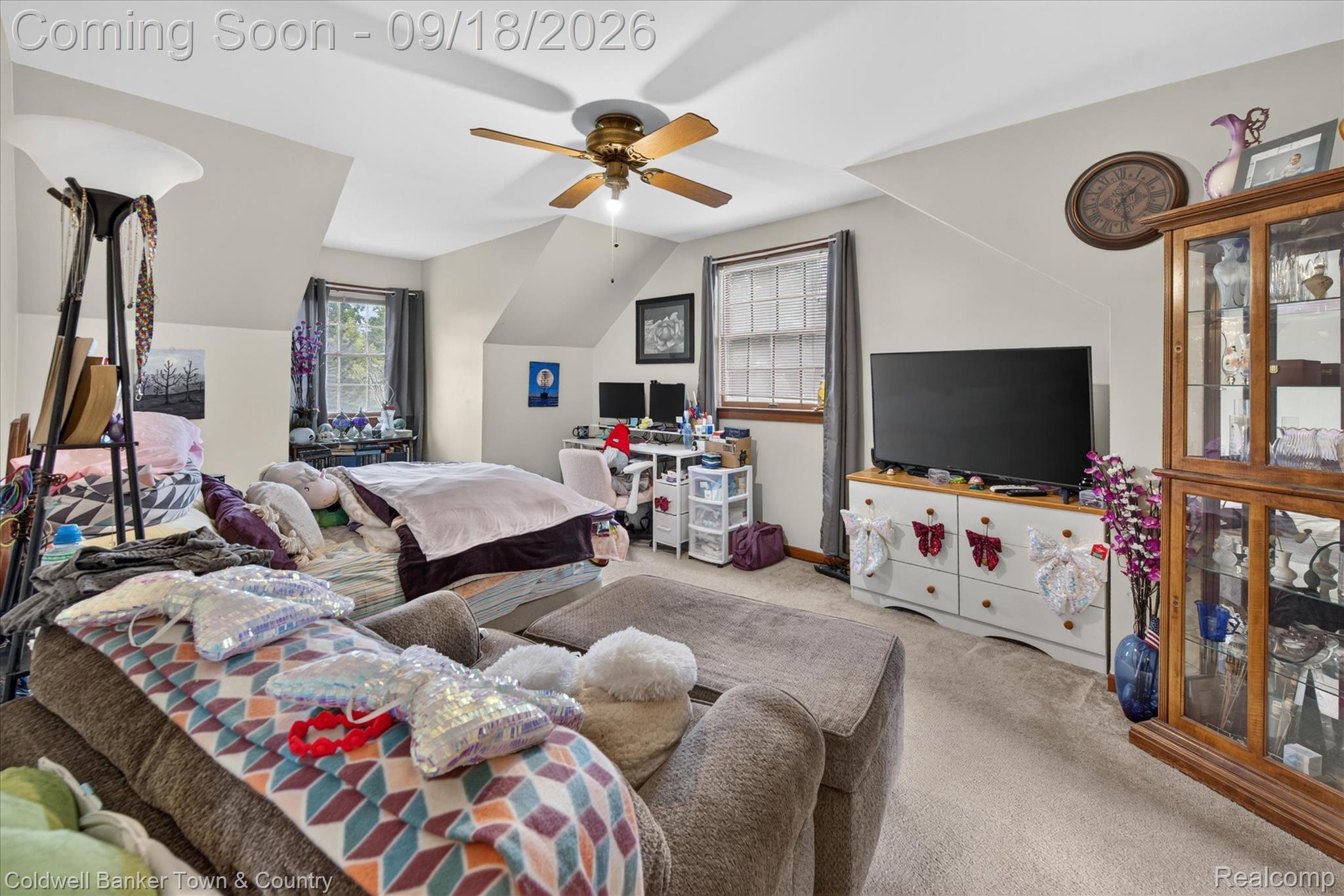 4442 McGunn Road Howell, MI 48843 - Photo 31 of 63 Carpeted room featuring a ceiling fan, sloped ceilings, and two windows