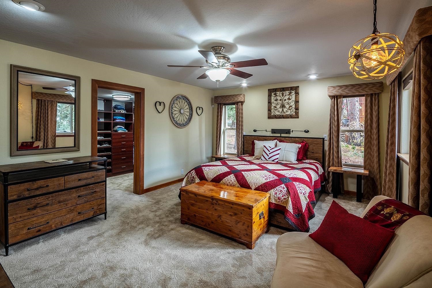 12095 Rainbow Drive Truckee, CA 96161 - Photo 13 of 21 a bedroom with a bed and a chandelier