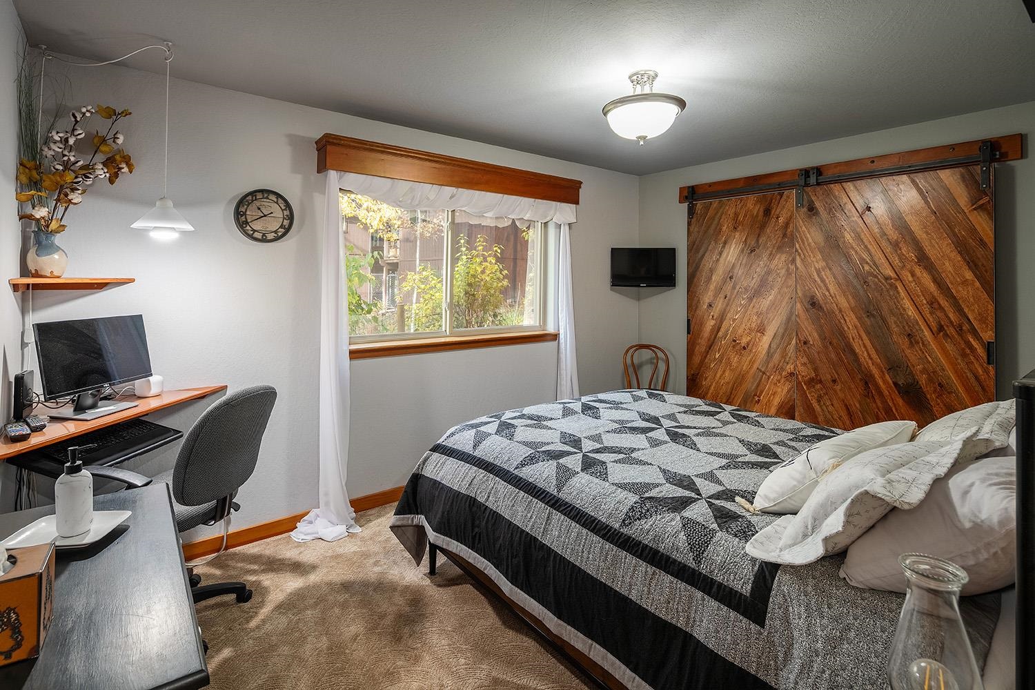 12095 Rainbow Drive Truckee, CA 96161 - Photo 15 of 21 a bedroom with a bed and a window