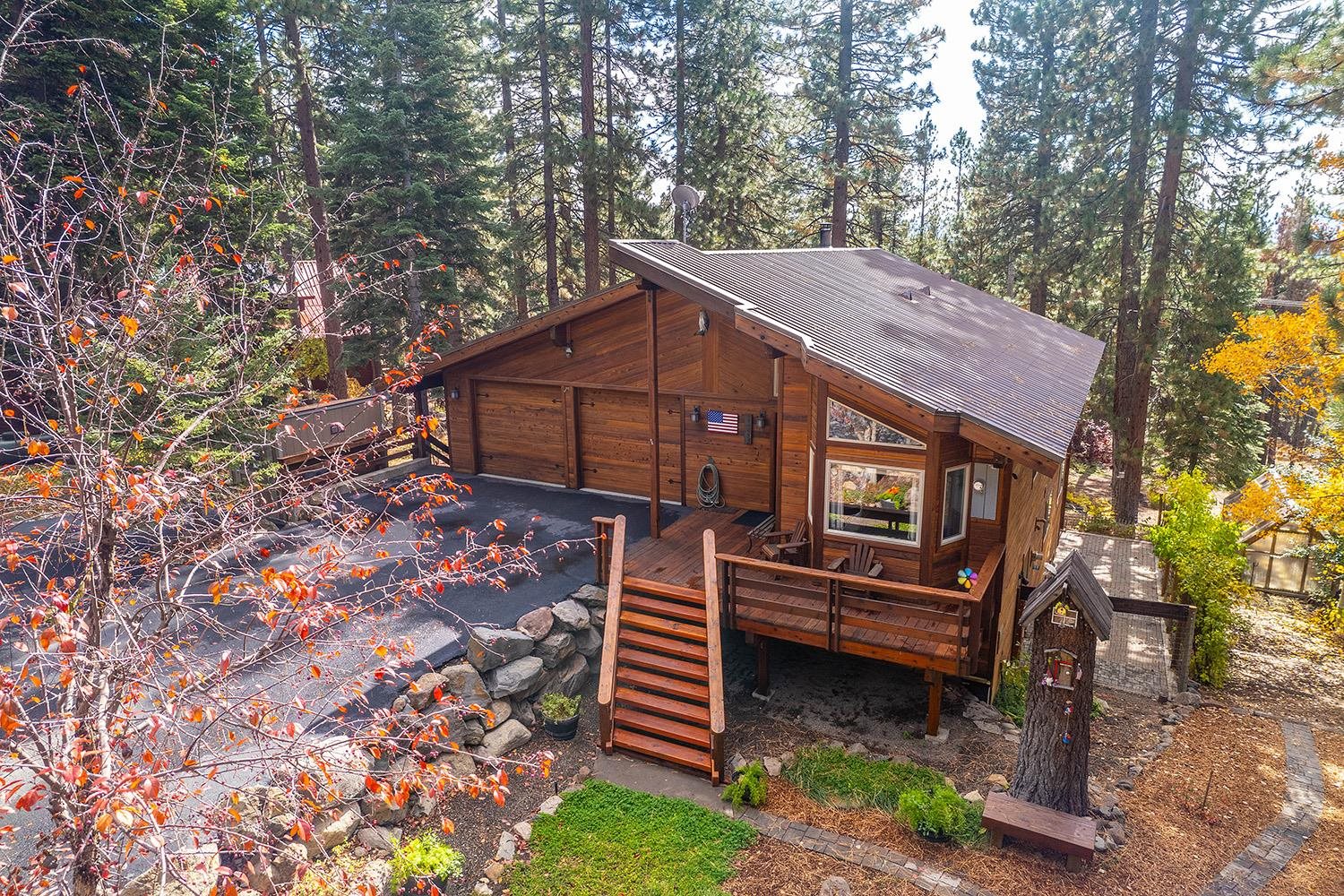 12095 Rainbow Drive Truckee, CA 96161 - Photo 21 of 21 a backyard of a house with wooden fence and trees