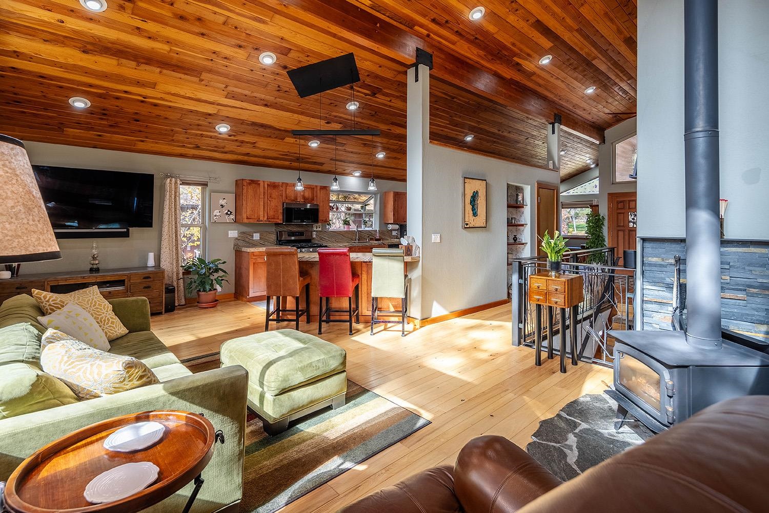 12095 Rainbow Drive Truckee, CA 96161 - Photo 8 of 21 a living room filled with furniture and a flat screen tv
