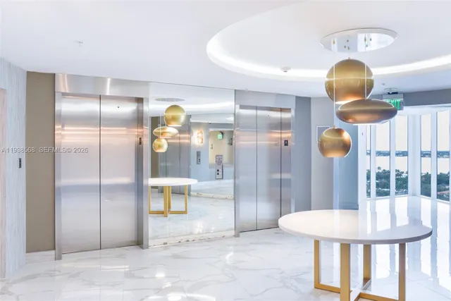 a view of a bathroom with a tub and shower