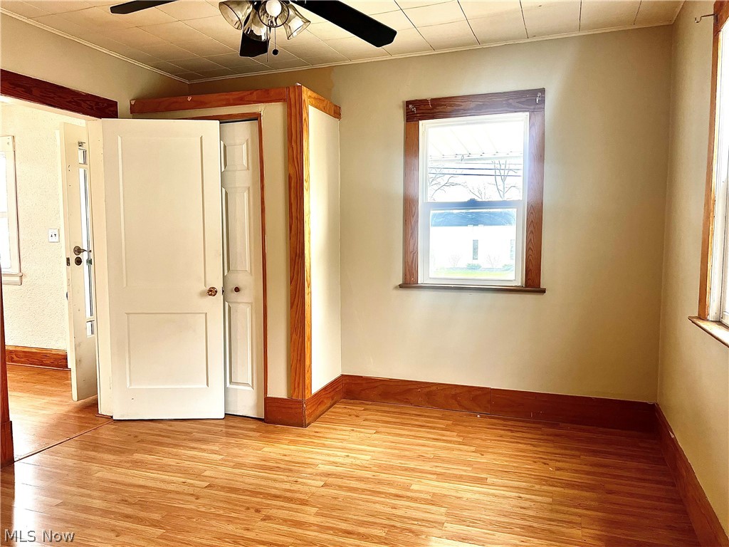 67 Forbes Road Bedford, OH 44146 - Photo 9 of 20 Unfurnished bedroom featuring light wood-type flooring, a closet, and ceiling fan