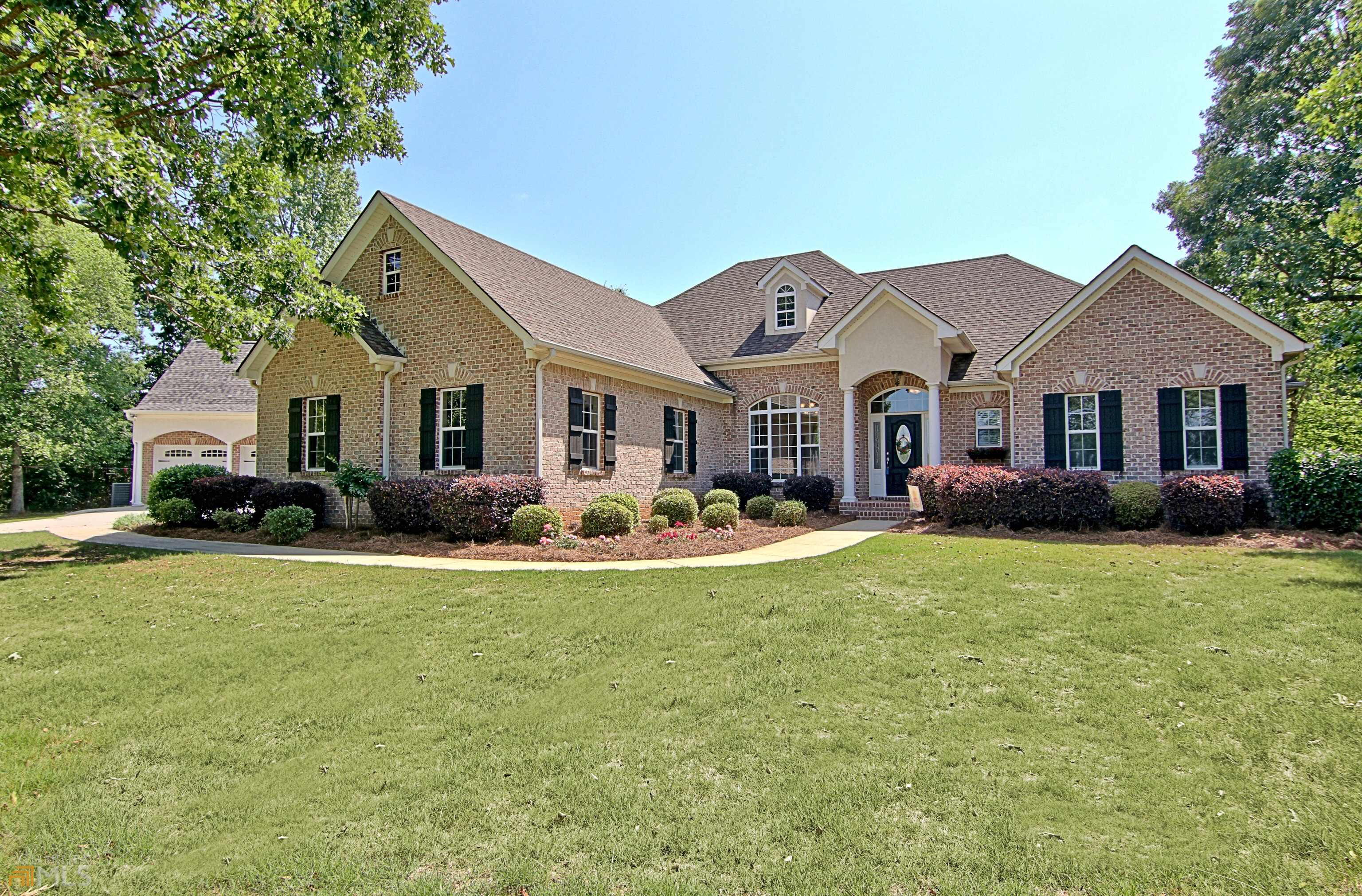 1320 Concord Road Concord, GA 30206 - Photo 1 of 1 a front view of a house with a garden and porch