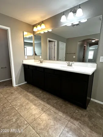 a view of kitchen with kitchen island sink and wooden floor