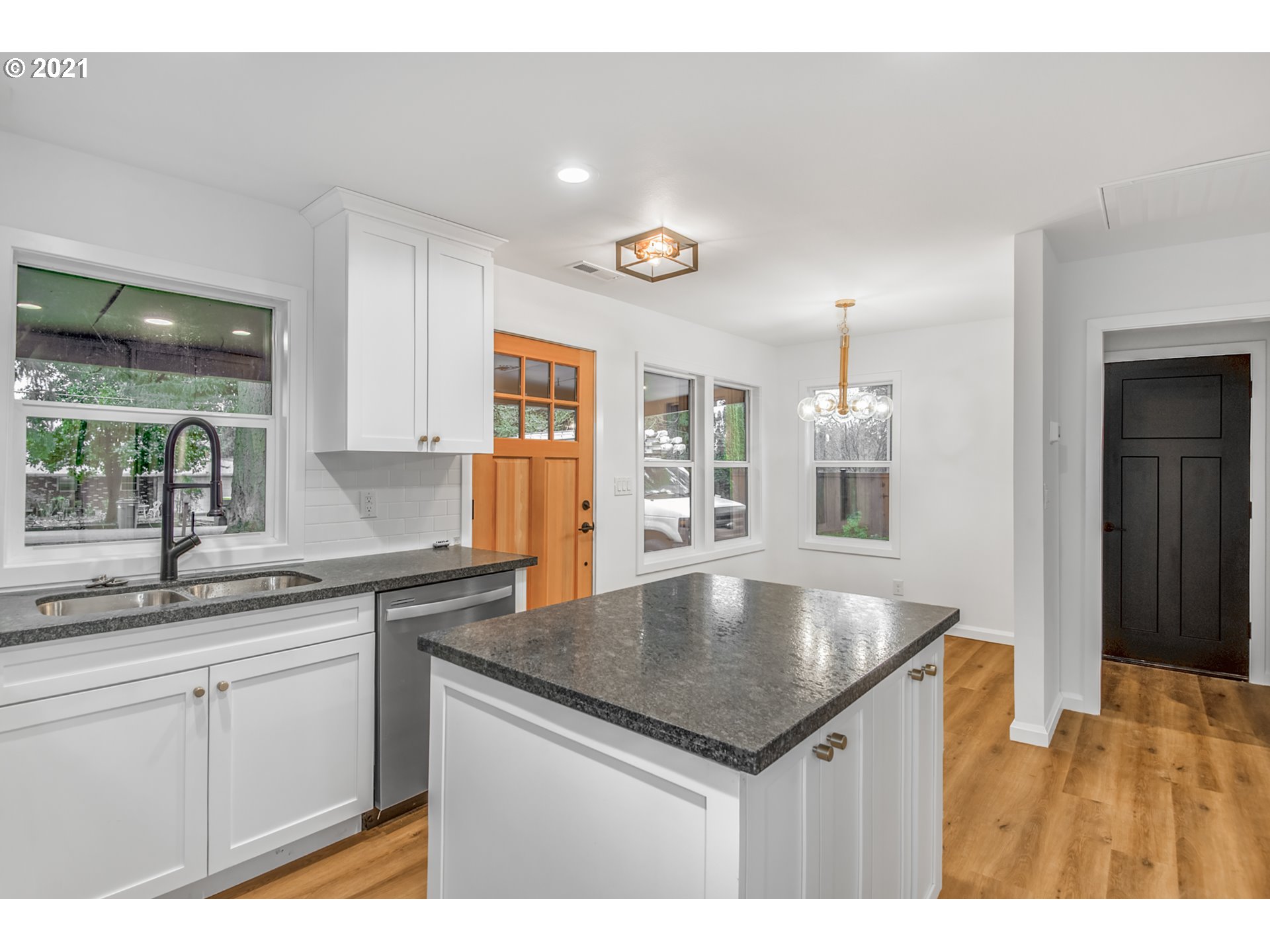 7515 Southwest Mapleleaf Street Portland, OR 97223 - Photo 9 of 25 a kitchen with a sink and cabinets