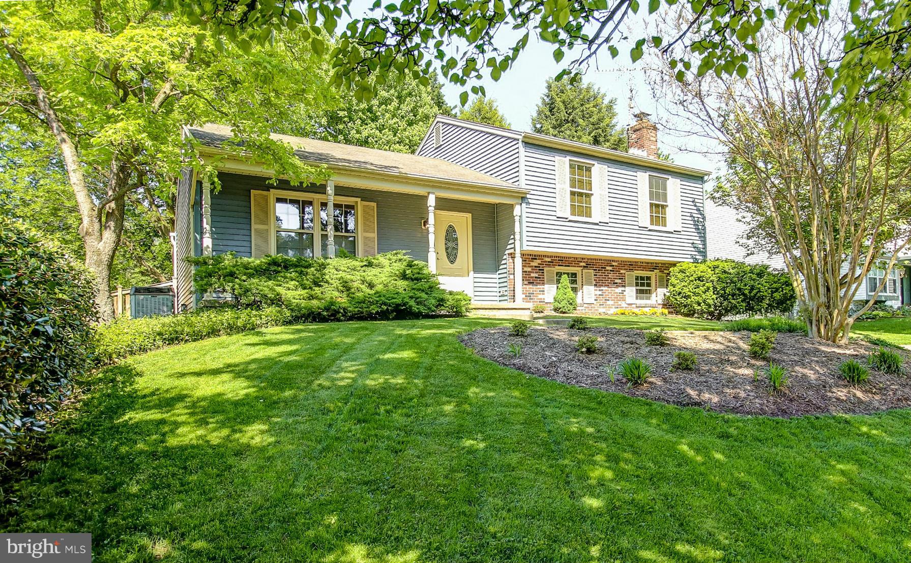 9338 Oak White Road Baltimore, MD 21236 - Photo 1 of 27 front view of a house with a yard