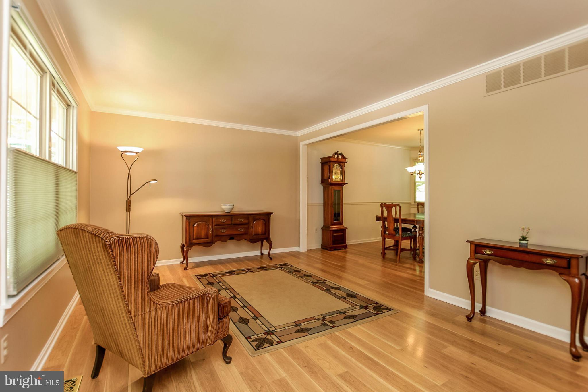 9338 Oak White Road Baltimore, MD 21236 - Photo 2 of 27 a living room with furniture and a table