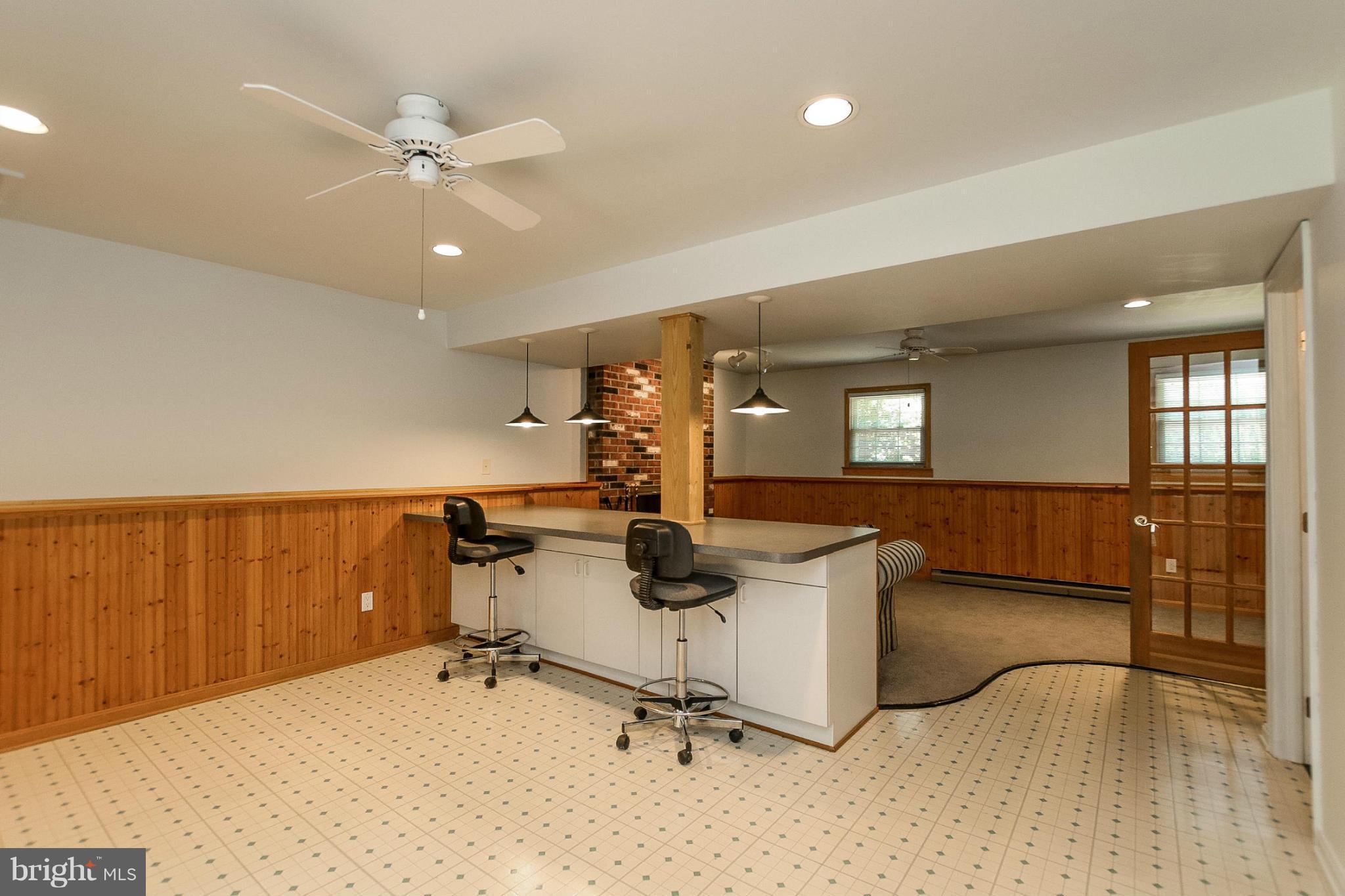 9338 Oak White Road Baltimore, MD 21236 - Photo 19 of 27 a room with gym equipment and view of living room