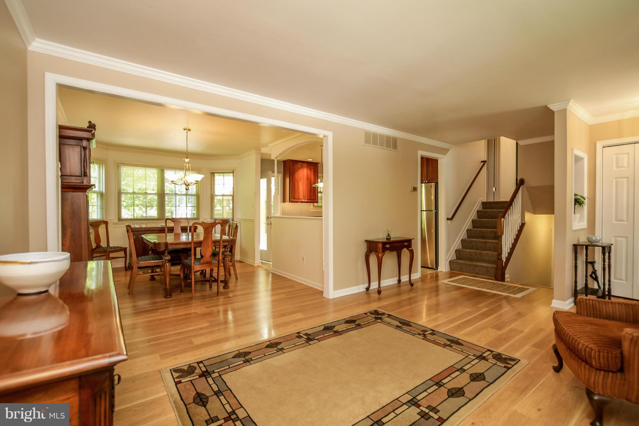 9338 Oak White Road Baltimore, MD 21236 - Photo 3 of 27 a living room with lots of furniture and a rug