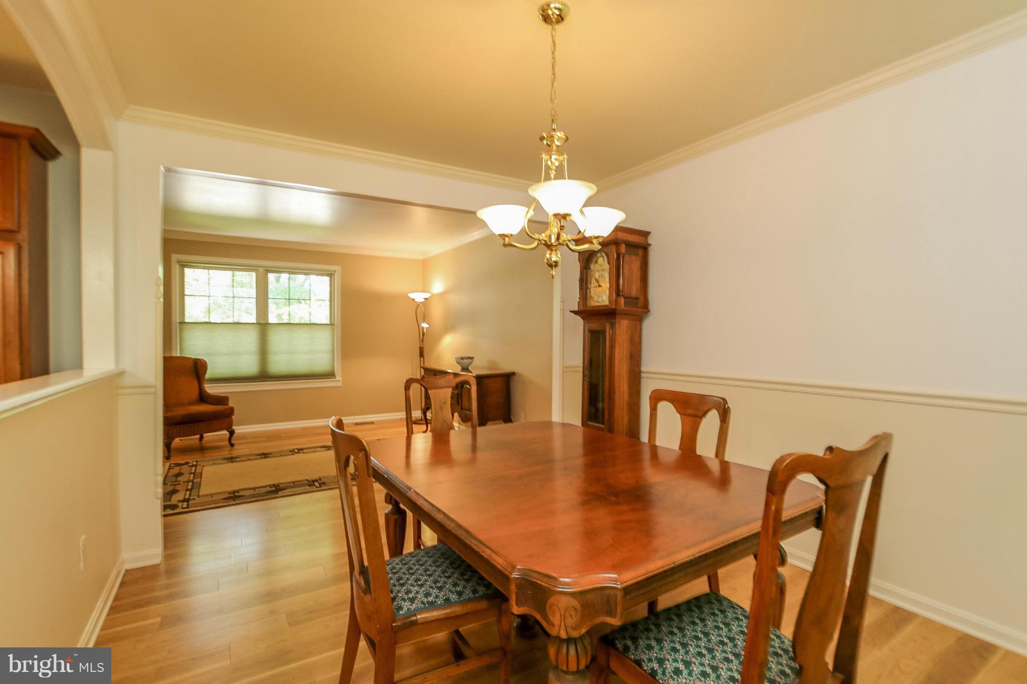 9338 Oak White Road Baltimore, MD 21236 - Photo 4 of 27 a view of a dining room with furniture and wooden floor