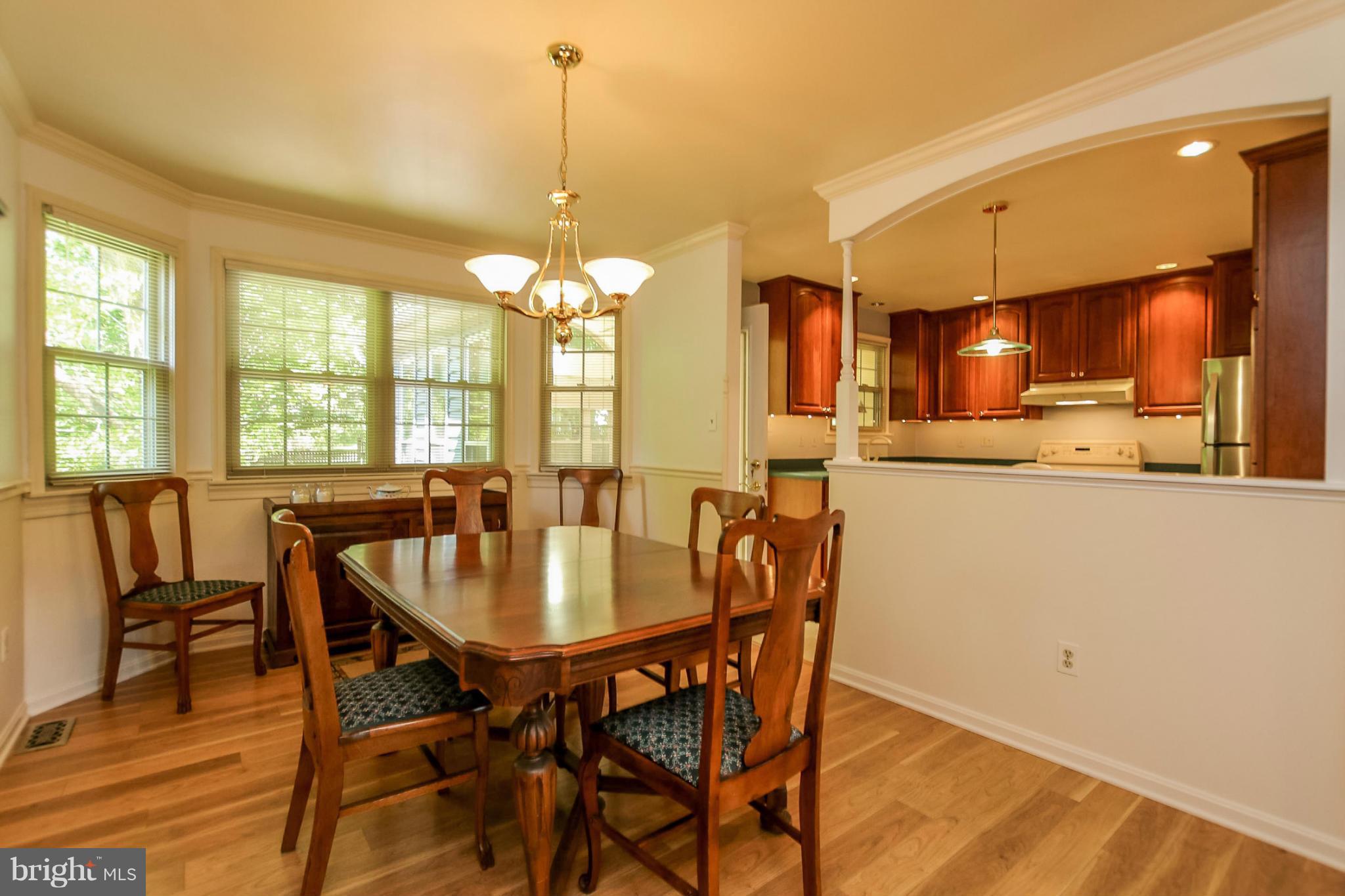 9338 Oak White Road Baltimore, MD 21236 - Photo 5 of 27 a dining room with furniture and window