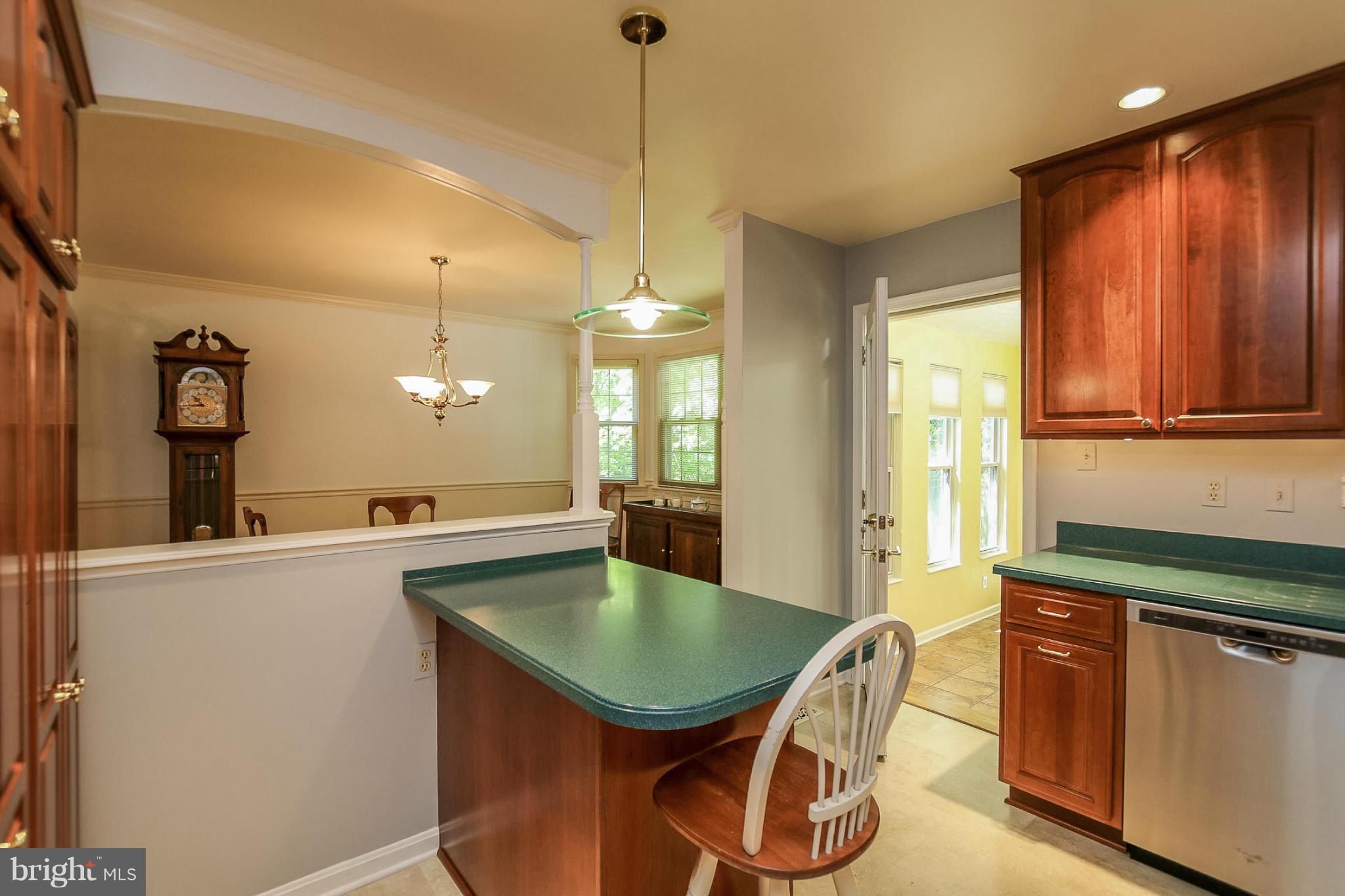 9338 Oak White Road Baltimore, MD 21236 - Photo 7 of 27 a kitchen with a sink a counter space and a window