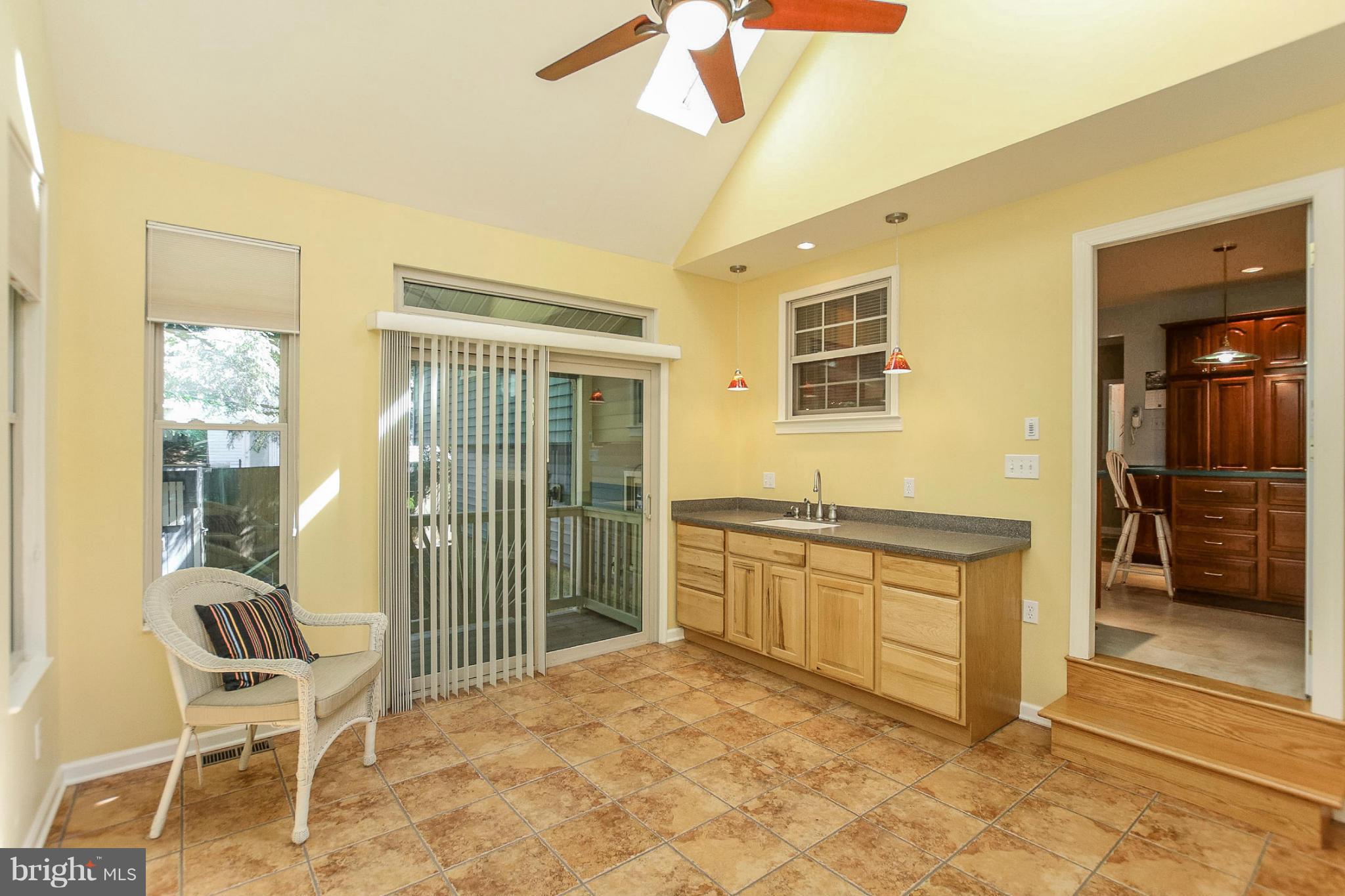 9338 Oak White Road Baltimore, MD 21236 - Photo 10 of 27 a spacious bedroom with a bed and a chair