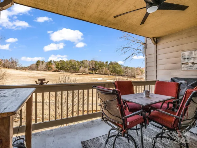 a view of a balcony with chairs