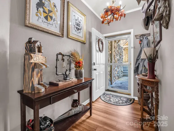 a view of room with guitars and wooden floor