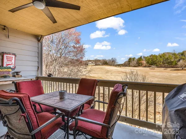 a view of a balcony with furniture