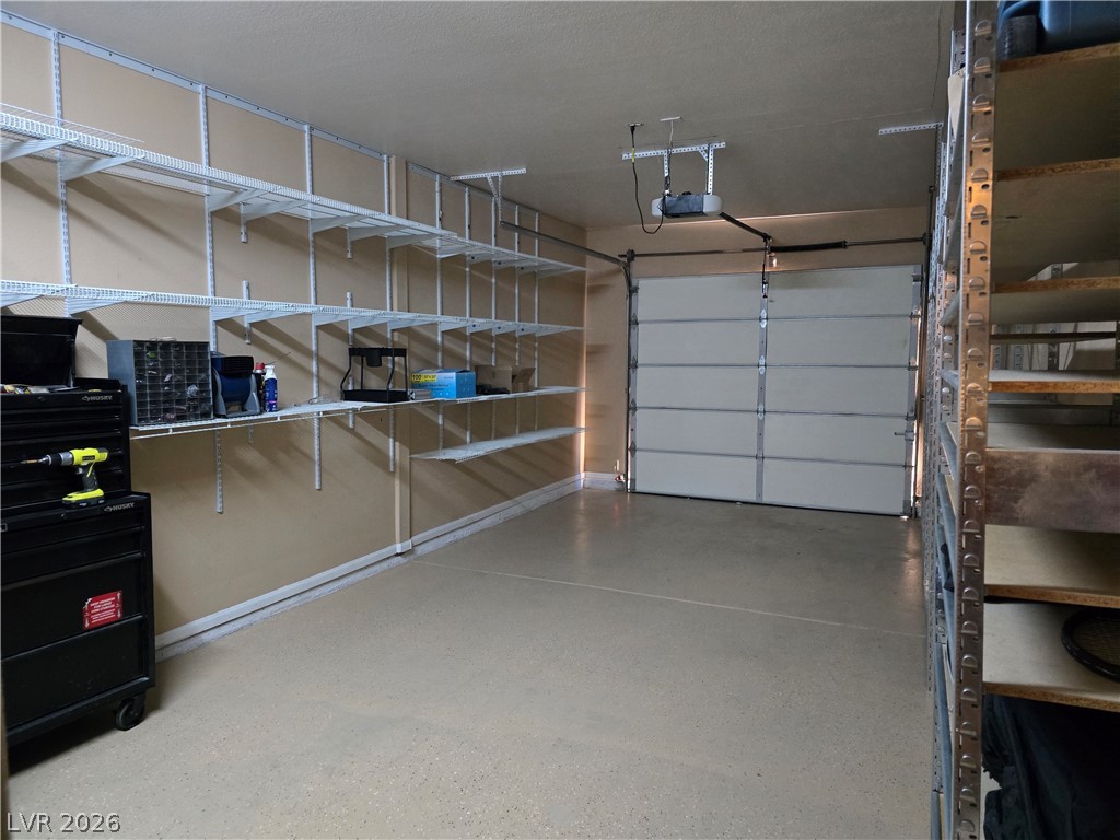2050 West Warm Springs Road, Unit 2422 Henderson, NV 89014 - Photo 34 of 44 This spacious garage offers abundant storage with built-in shelving and easy access.