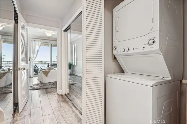 a view of washer and dryer with bathroom