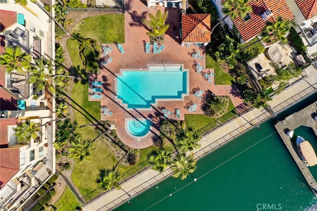 a view of swimming pool with a table and chairs