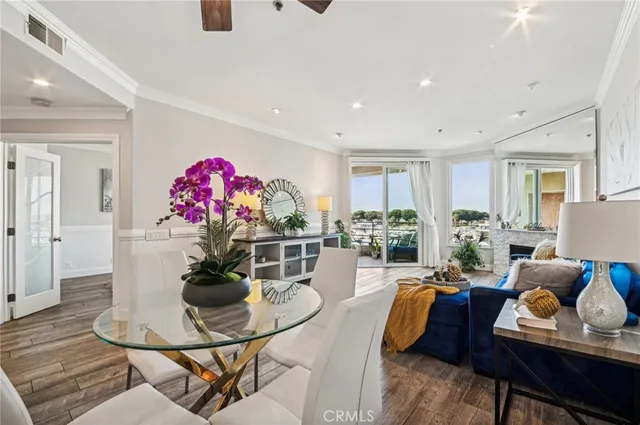 a living room with furniture and flowers