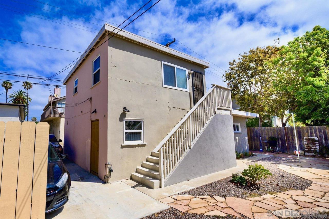 934 Reed Avenue San Diego, CA 92109 - Photo 15 of 39 a view of a house with backyard and trees