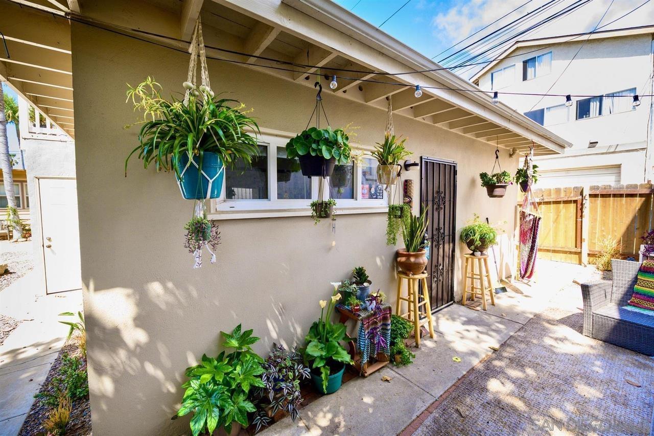 934 Reed Avenue San Diego, CA 92109 - Photo 19 of 39 a view of a porch with potted plants