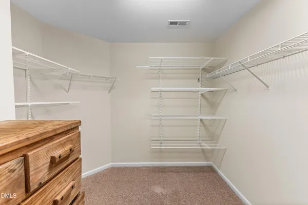a view of an empty walk in closet